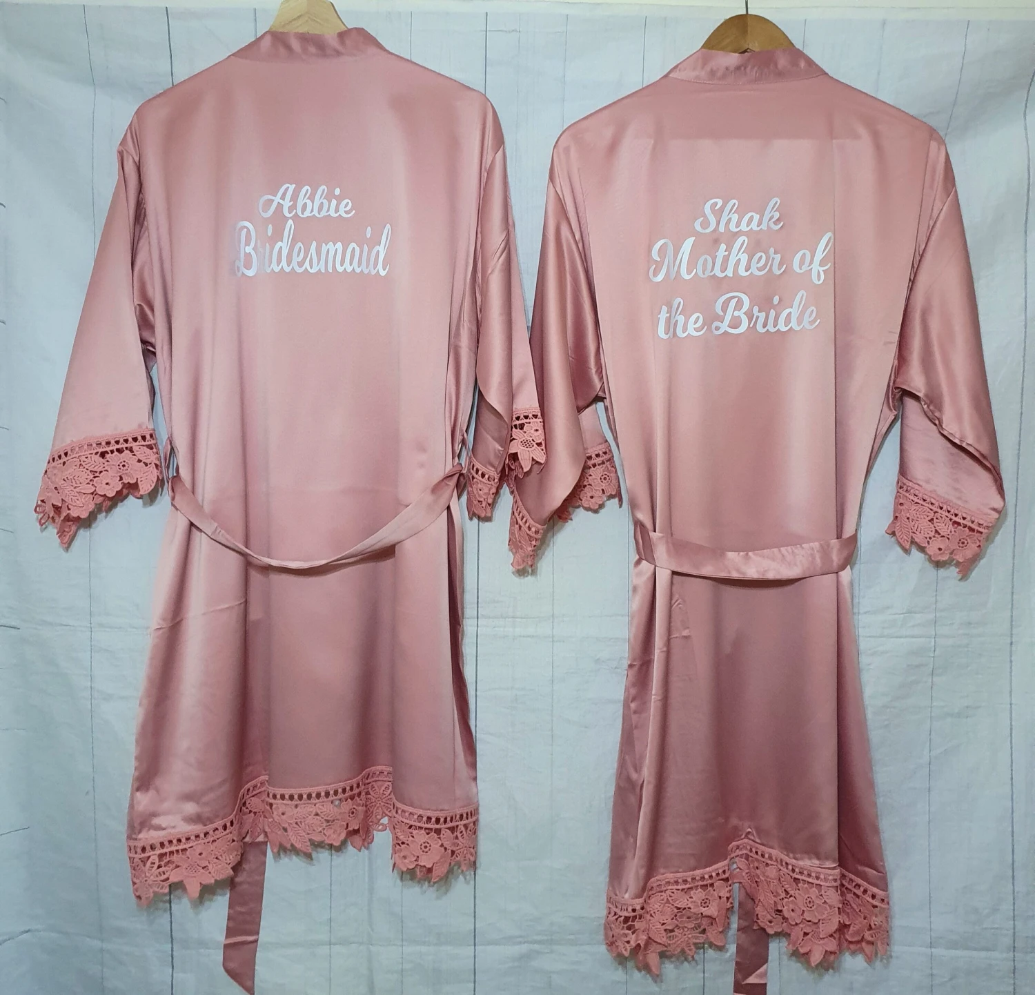 Wedding Gift Set. A Flute, White Wooden Clothing Hanger And A Robe Set. 1 Wedding Gift Set. A Flute, White Wooden Clothing Hanger And A Robe Set.